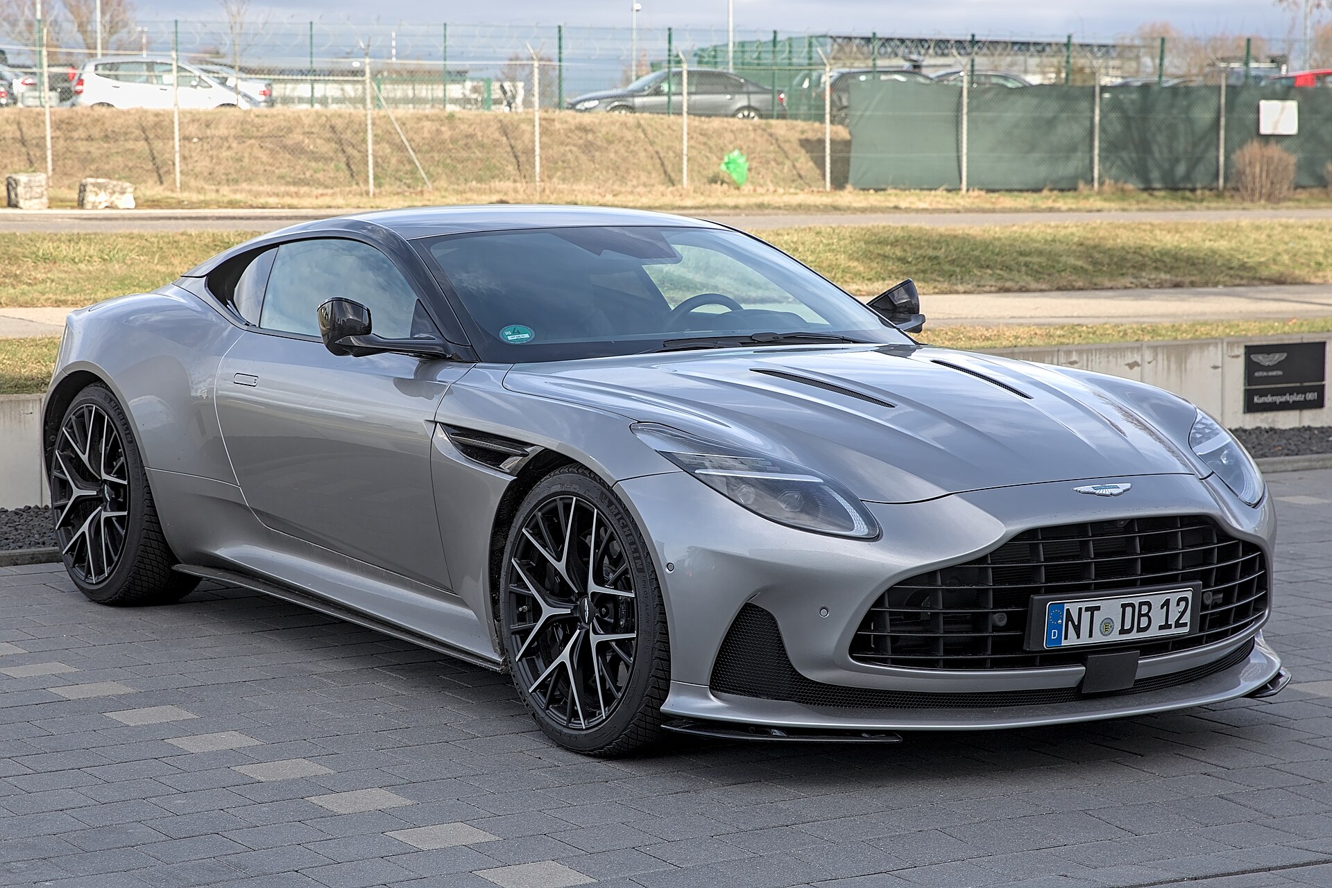 Aston Martin DB12 coupé at a motor show