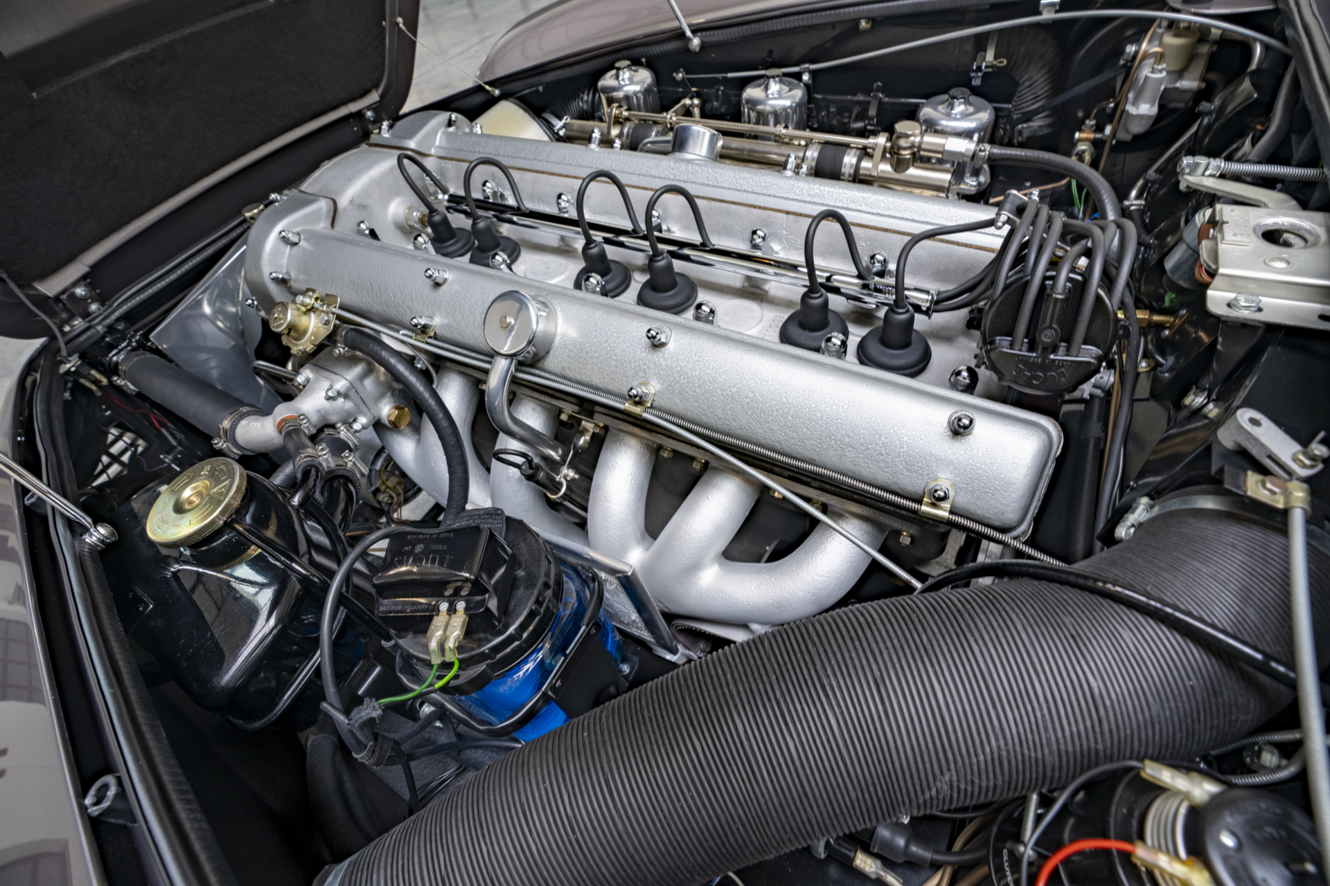 Aston Martin DB5 engine bay with twin-cam straight-six