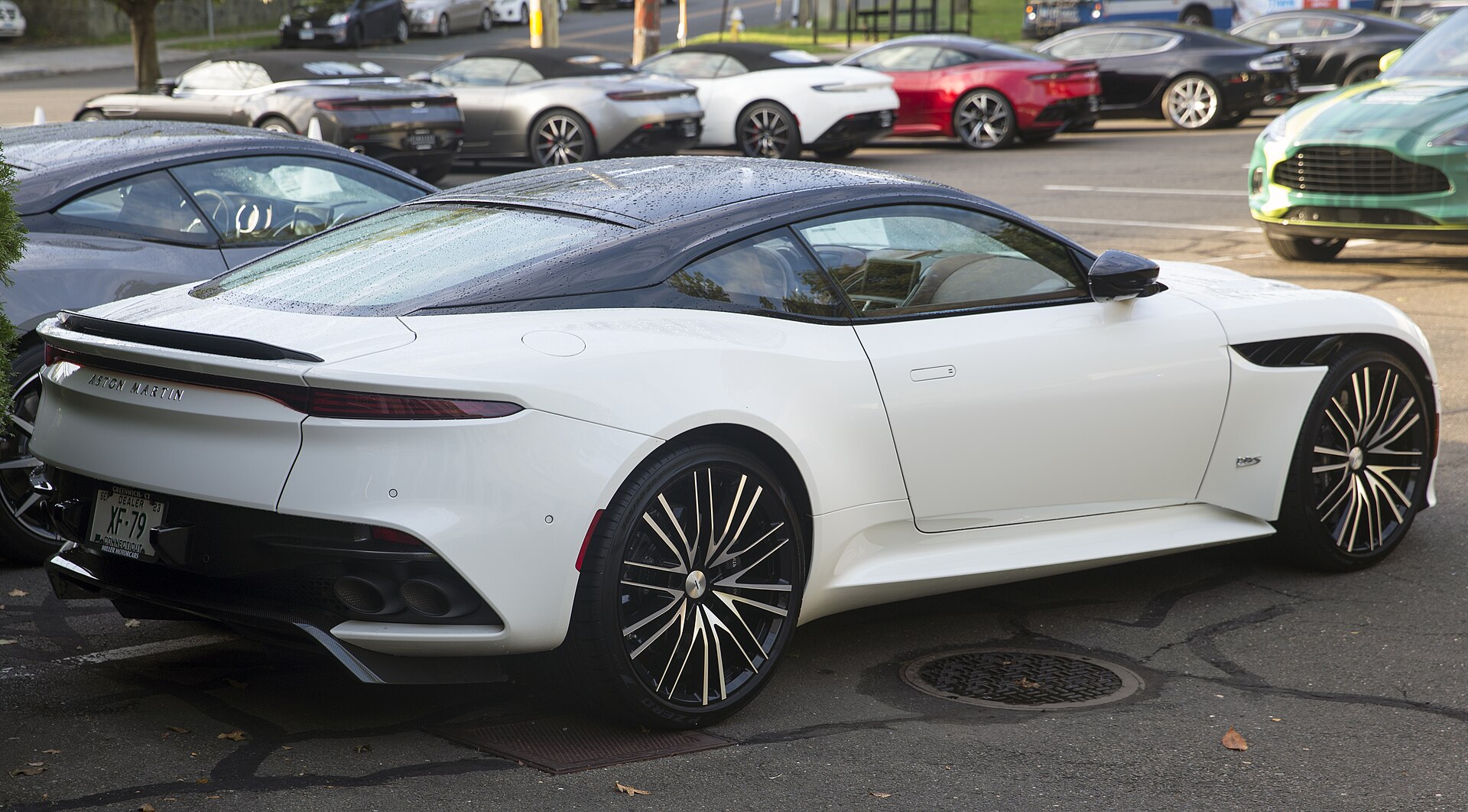 White Aston Martin DBS Superleggera rear three-quarter view