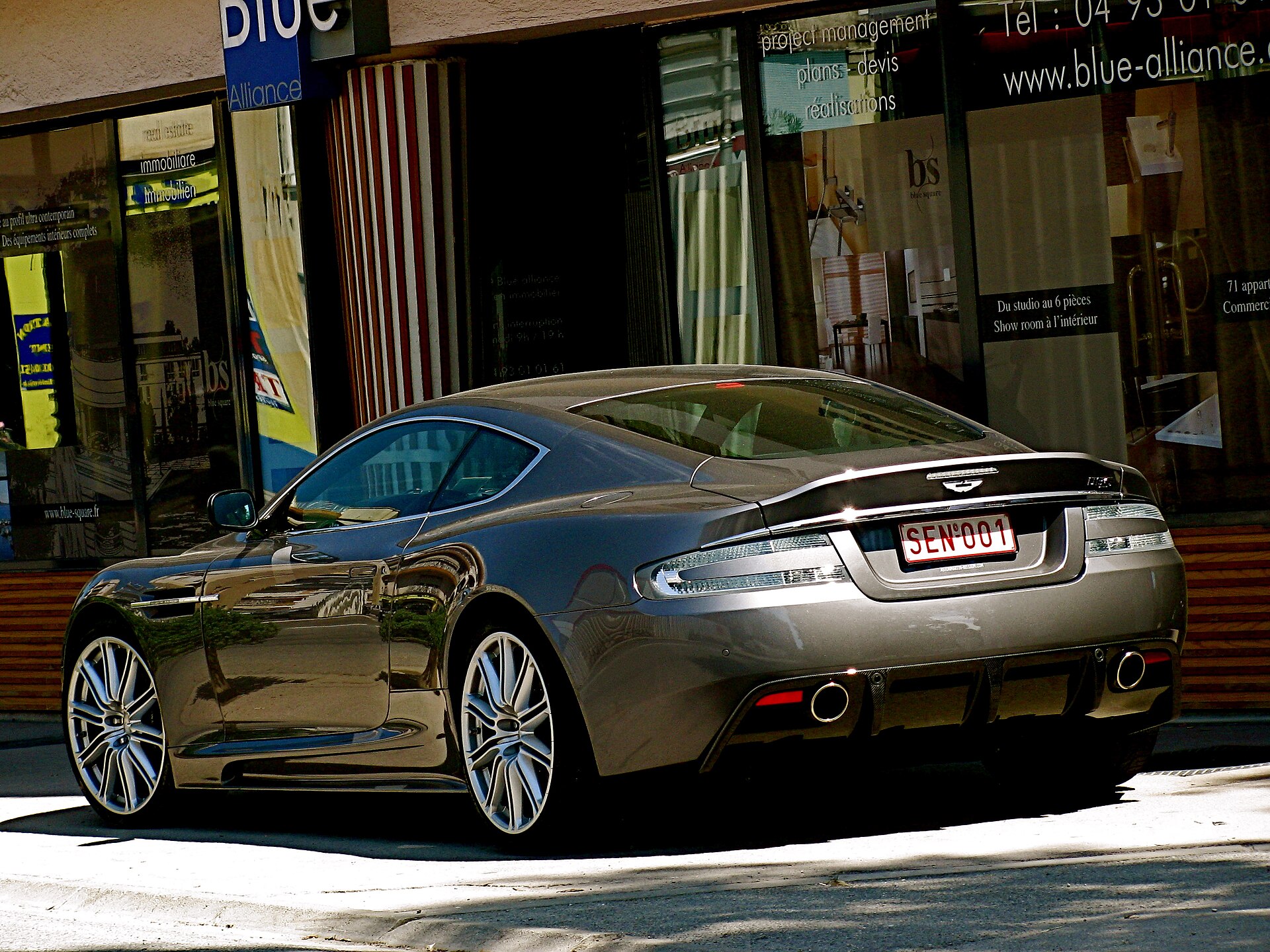 Silver Aston Martin DBS rear three-quarter view