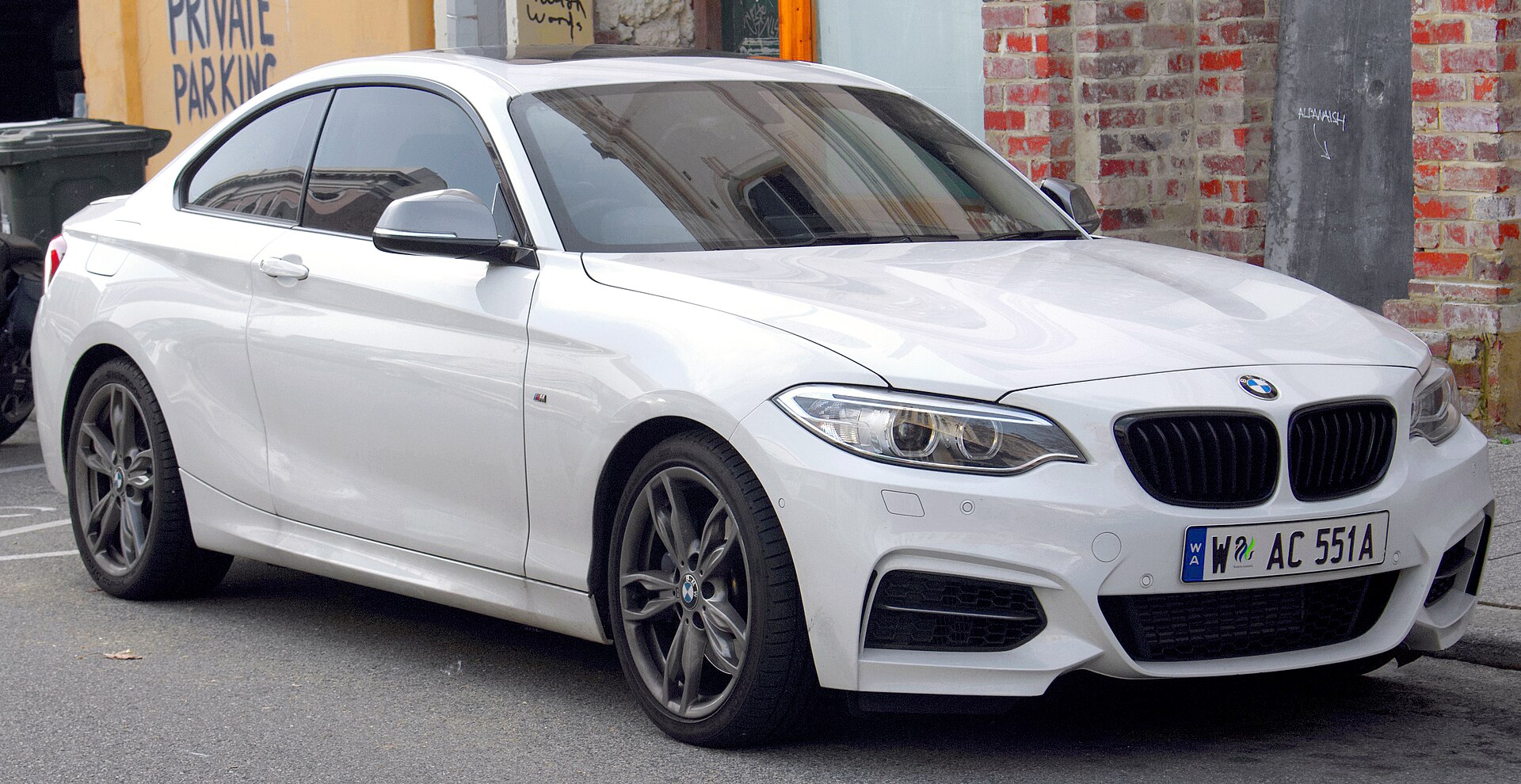 First-generation BMW M235i Coupé, front three-quarter view