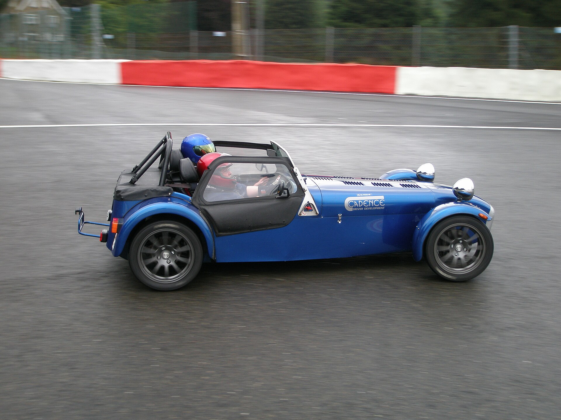 Several Caterham Seven race cars on a circuit
