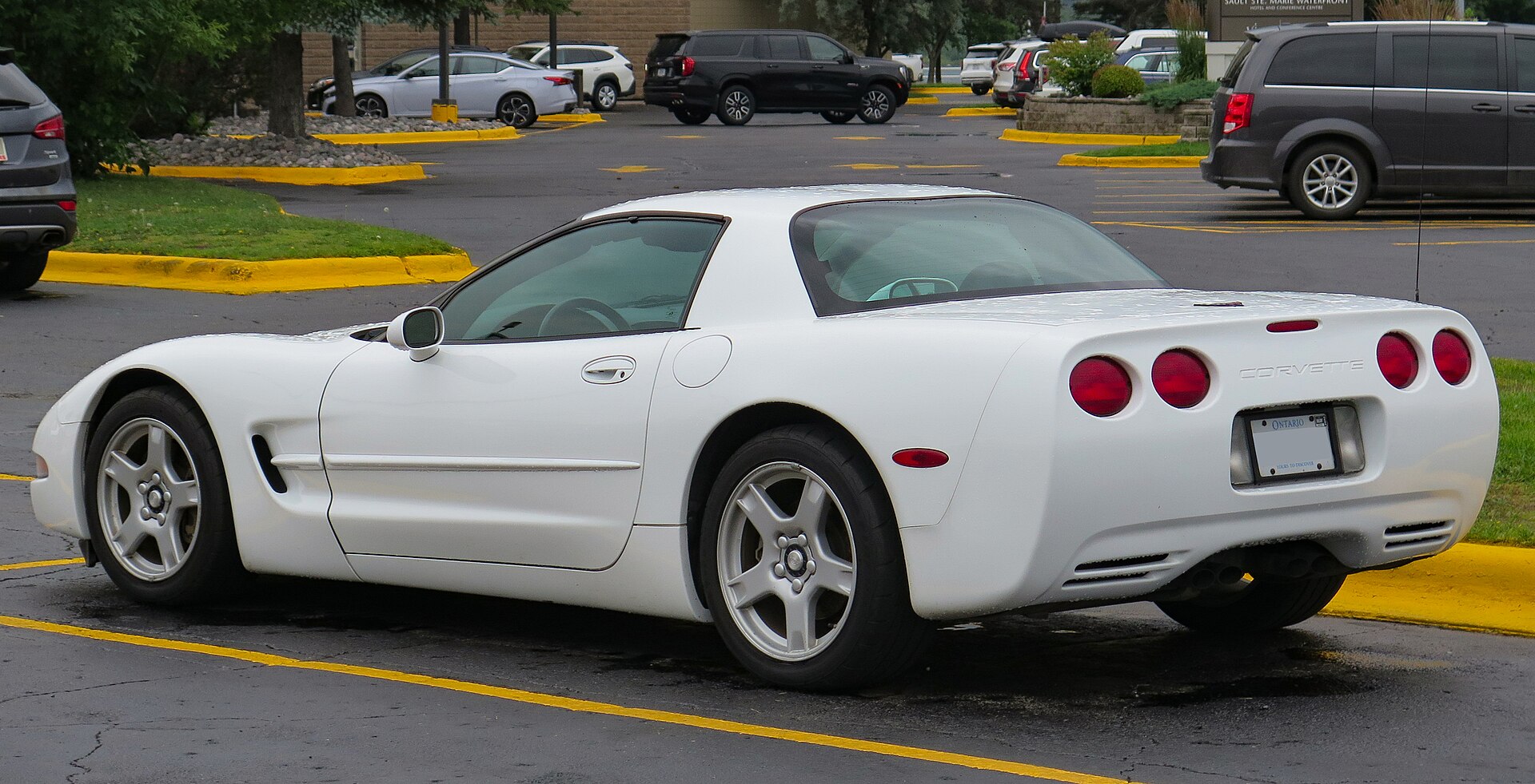 White 1999 Chevrolet Corvette hardtop, rear left view