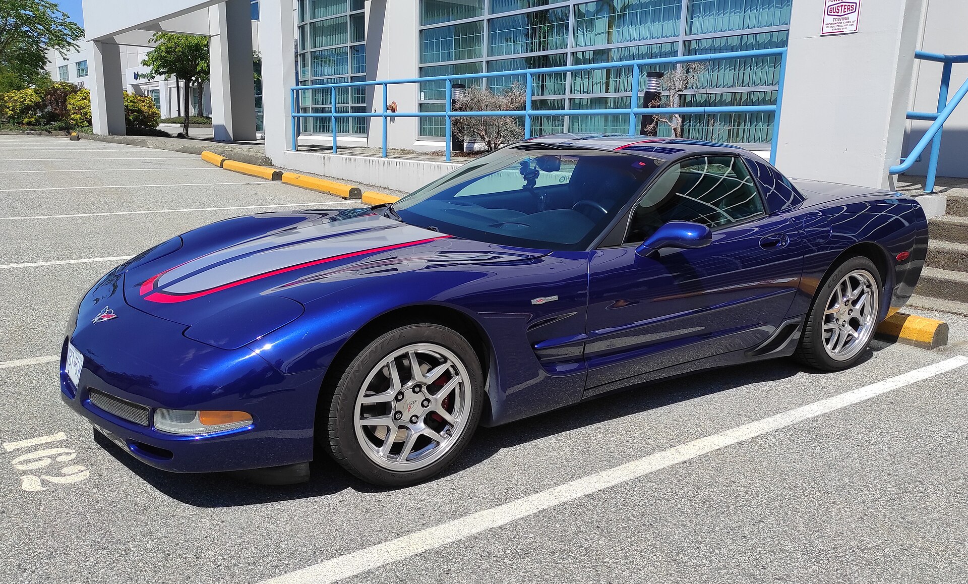 Blue 2004 Chevrolet Corvette Z06 Commemorative Edition with stripes