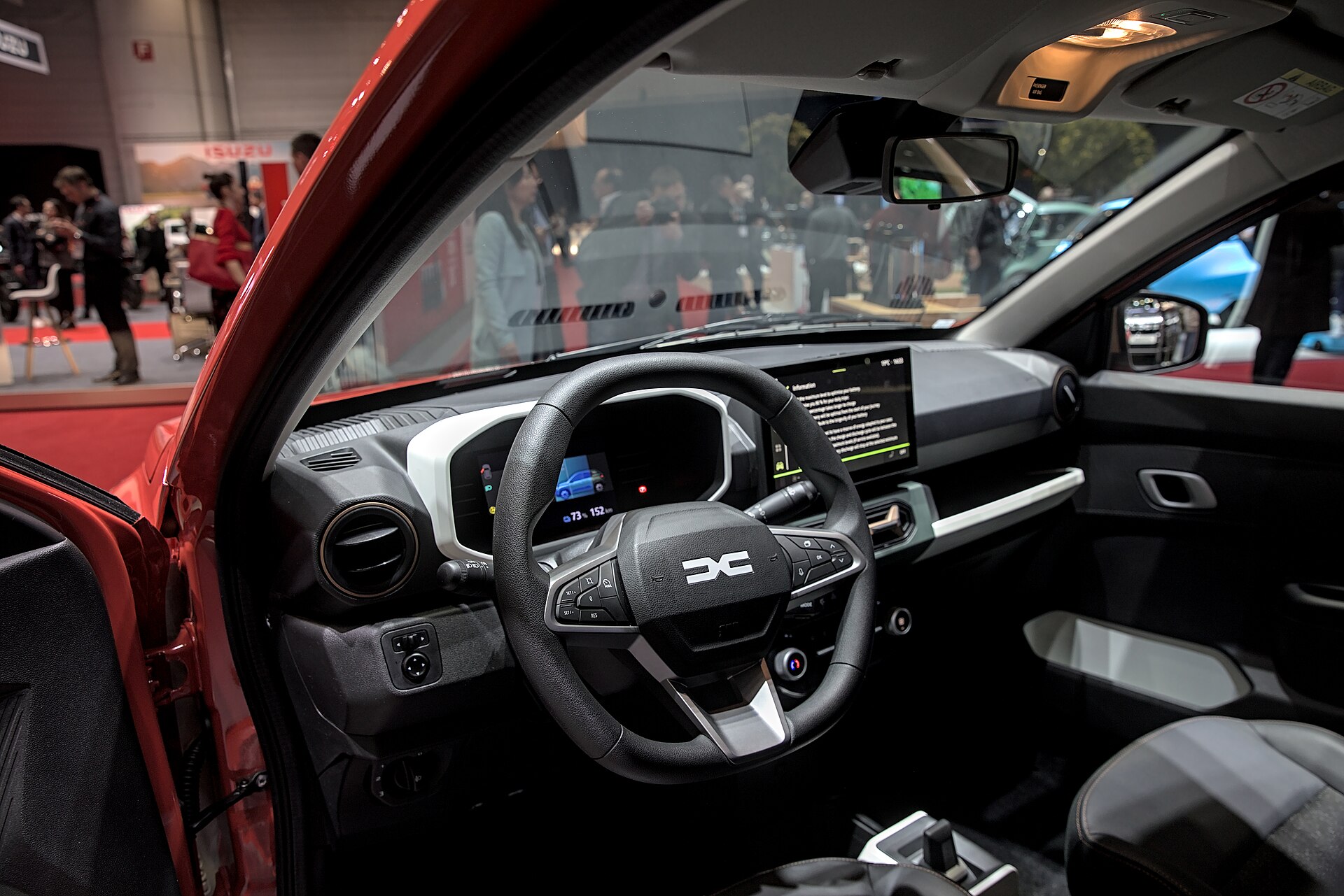 Facelifted Dacia Spring Extreme on a show stand