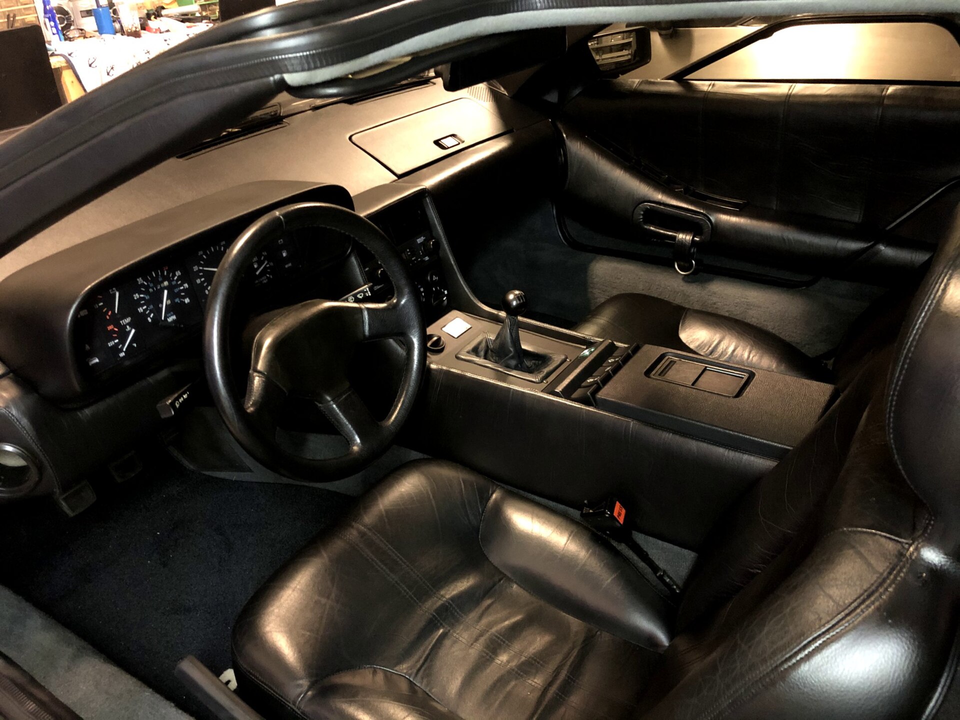Dashboard and seats of a DeLorean DMC-12 with black trim