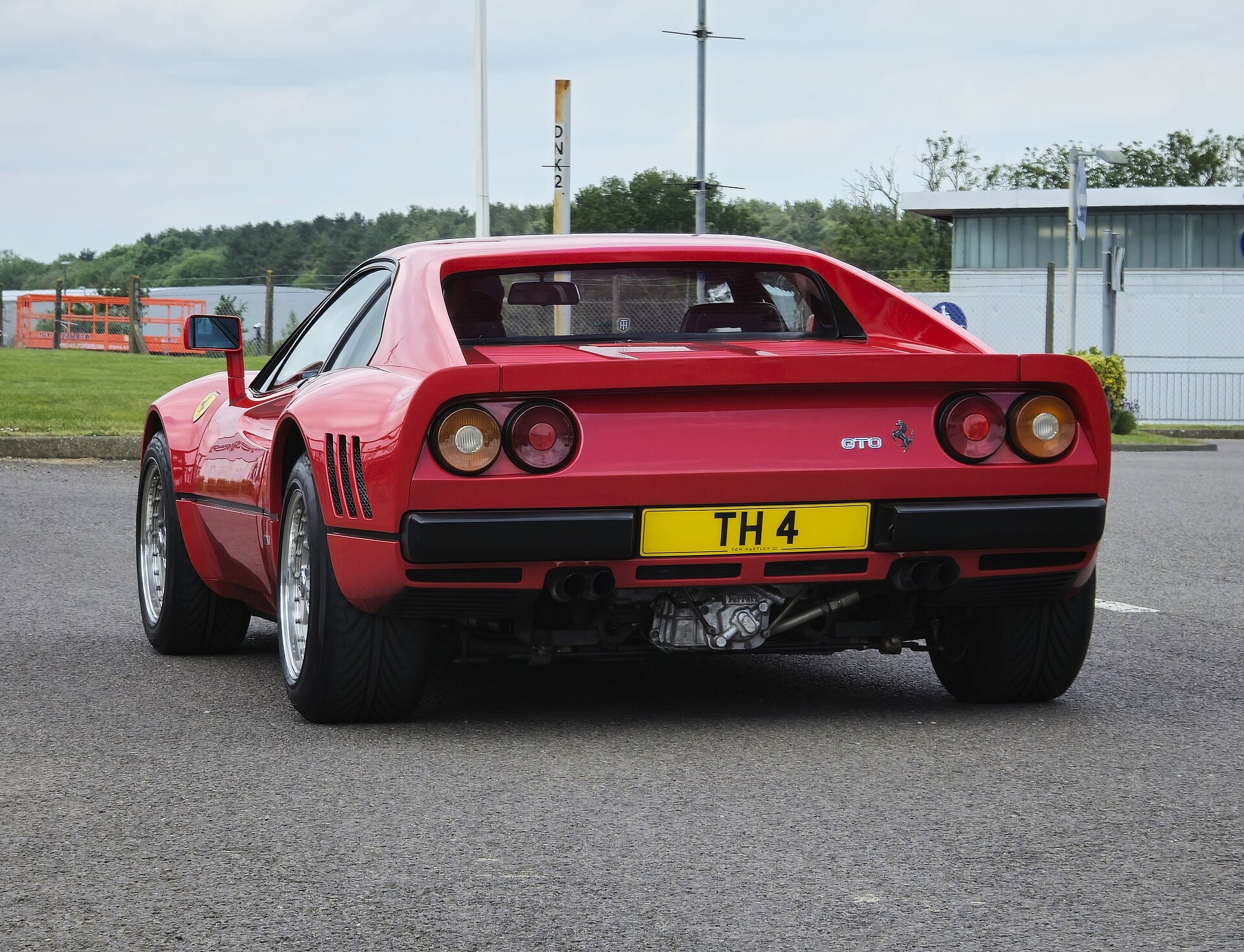 Red 1986 Ferrari 288 GTO, rear three-quarter view