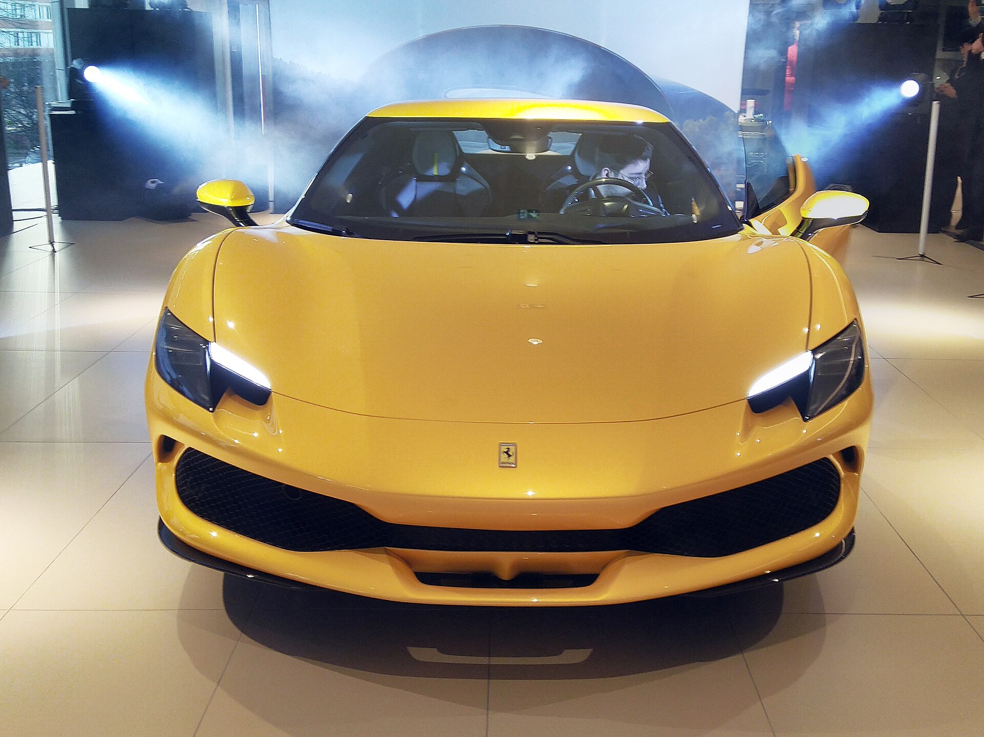 Ferrari 296 GTB side view at a motor show