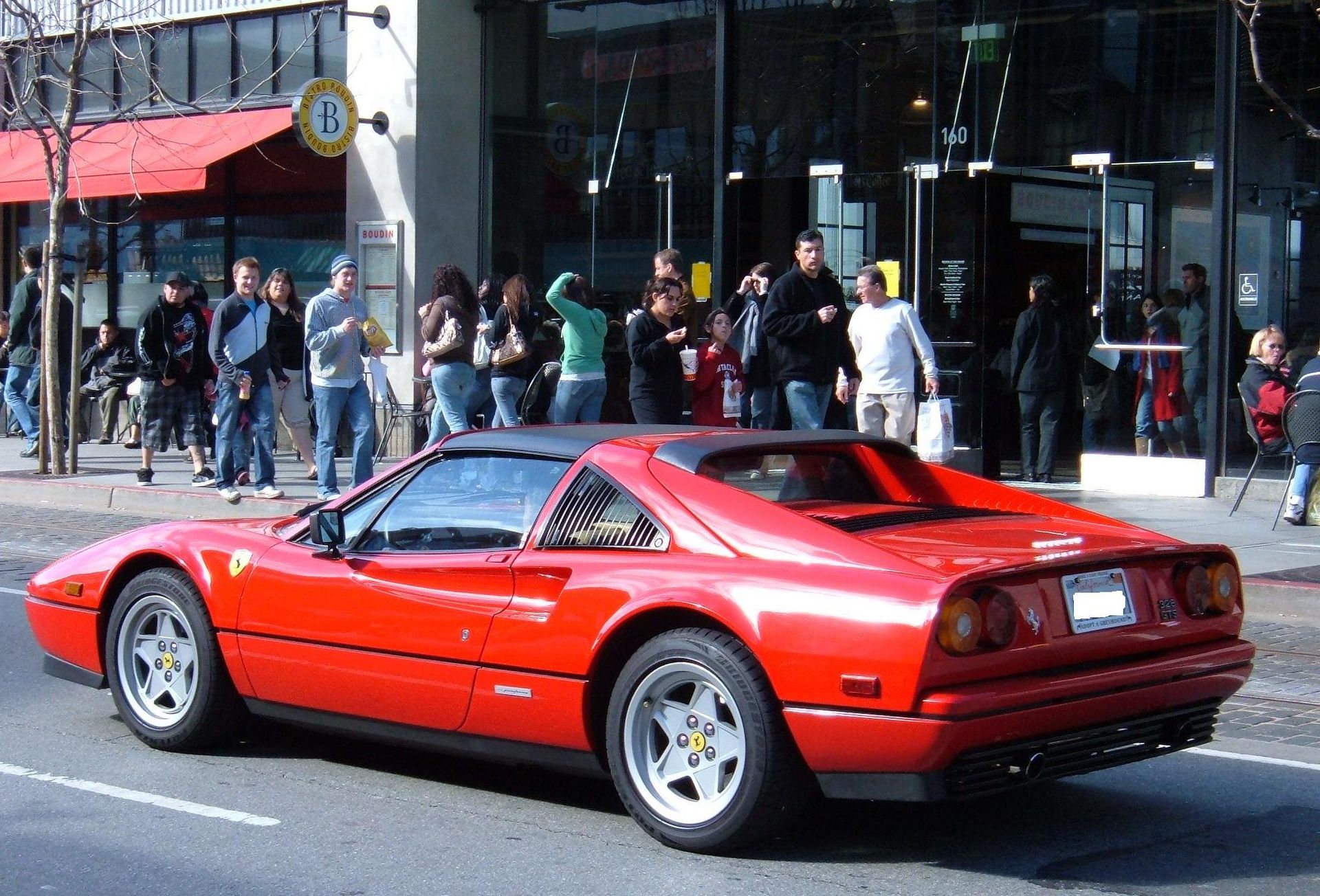 Ferrari 328 GTS parked in a street