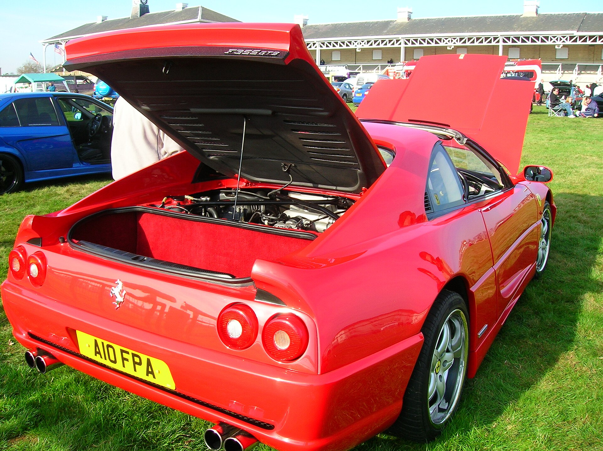 Red Ferrari F355 GTS with open targa roof