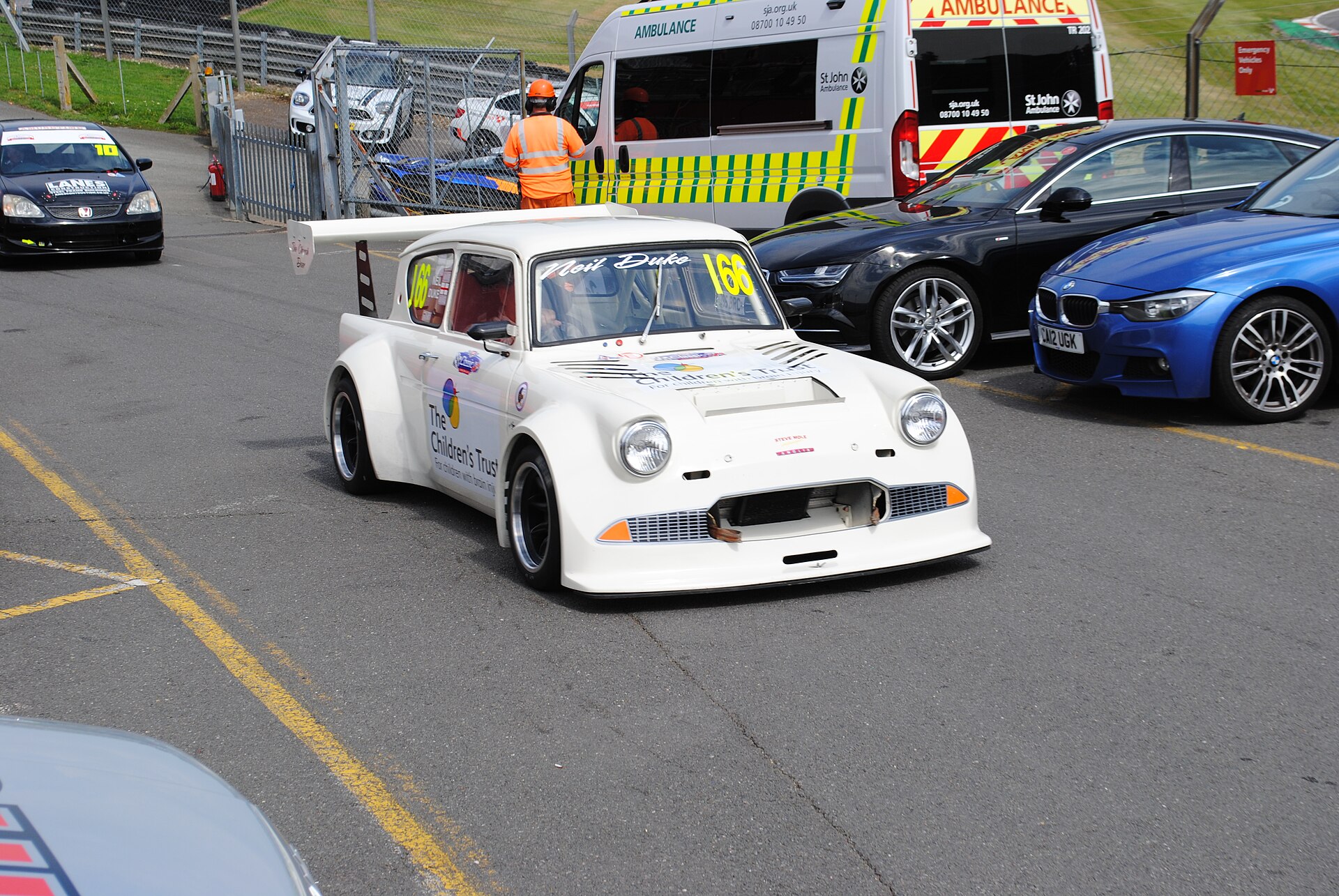Ford Anglia 105E saloon racing on the Brands Hatch circuit