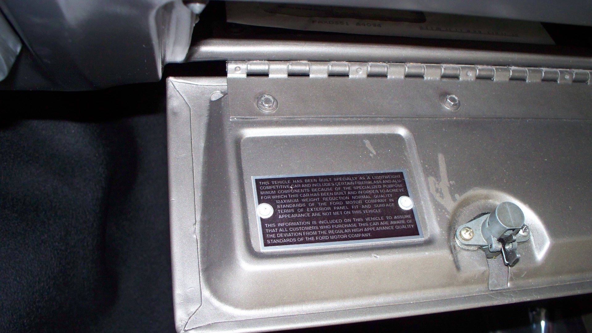 Plate on the glovebox of a 1964 Ford Thunderbolt