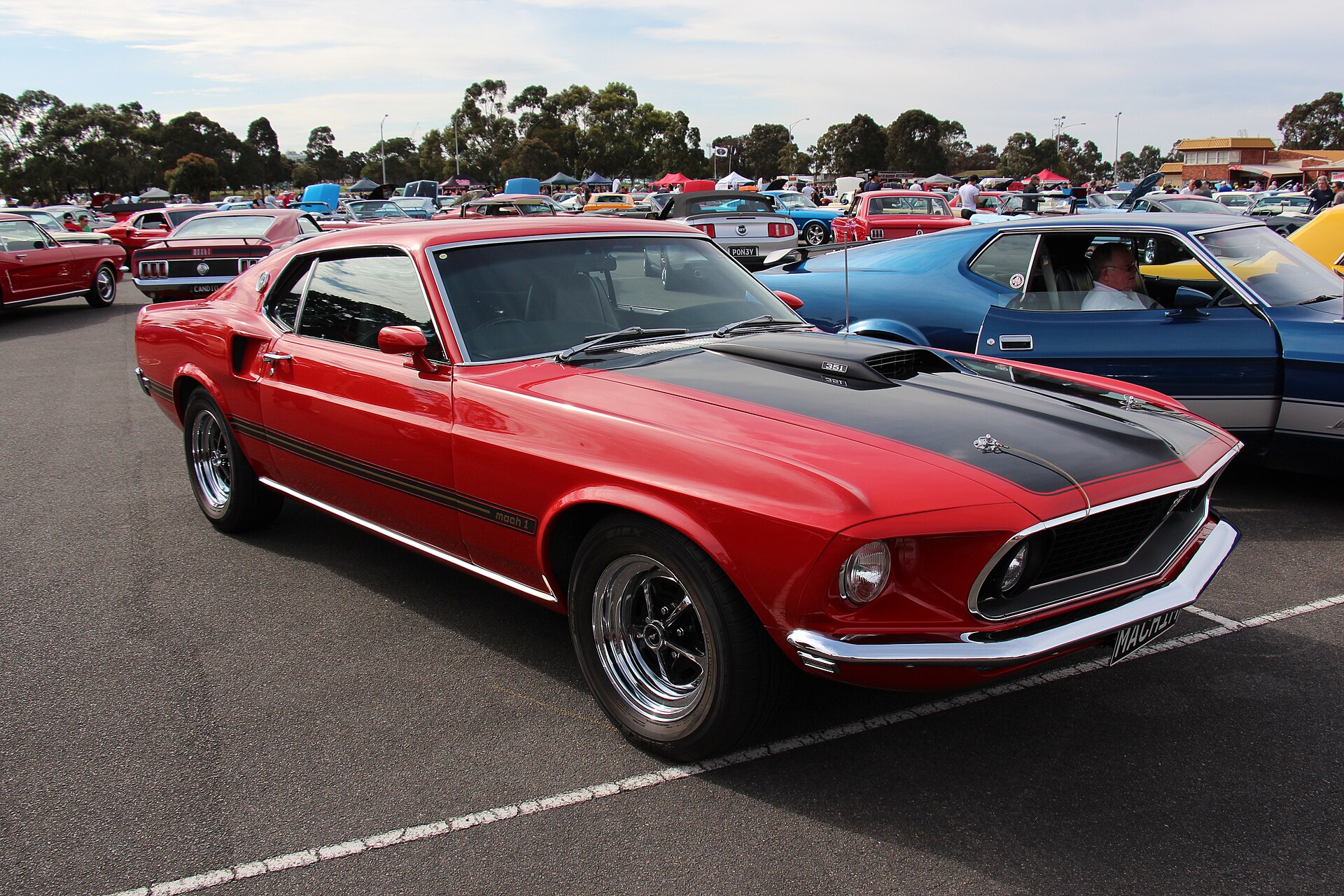 1969 Ford Mustang Mach 1 SportsRoof with black hood and hood pins