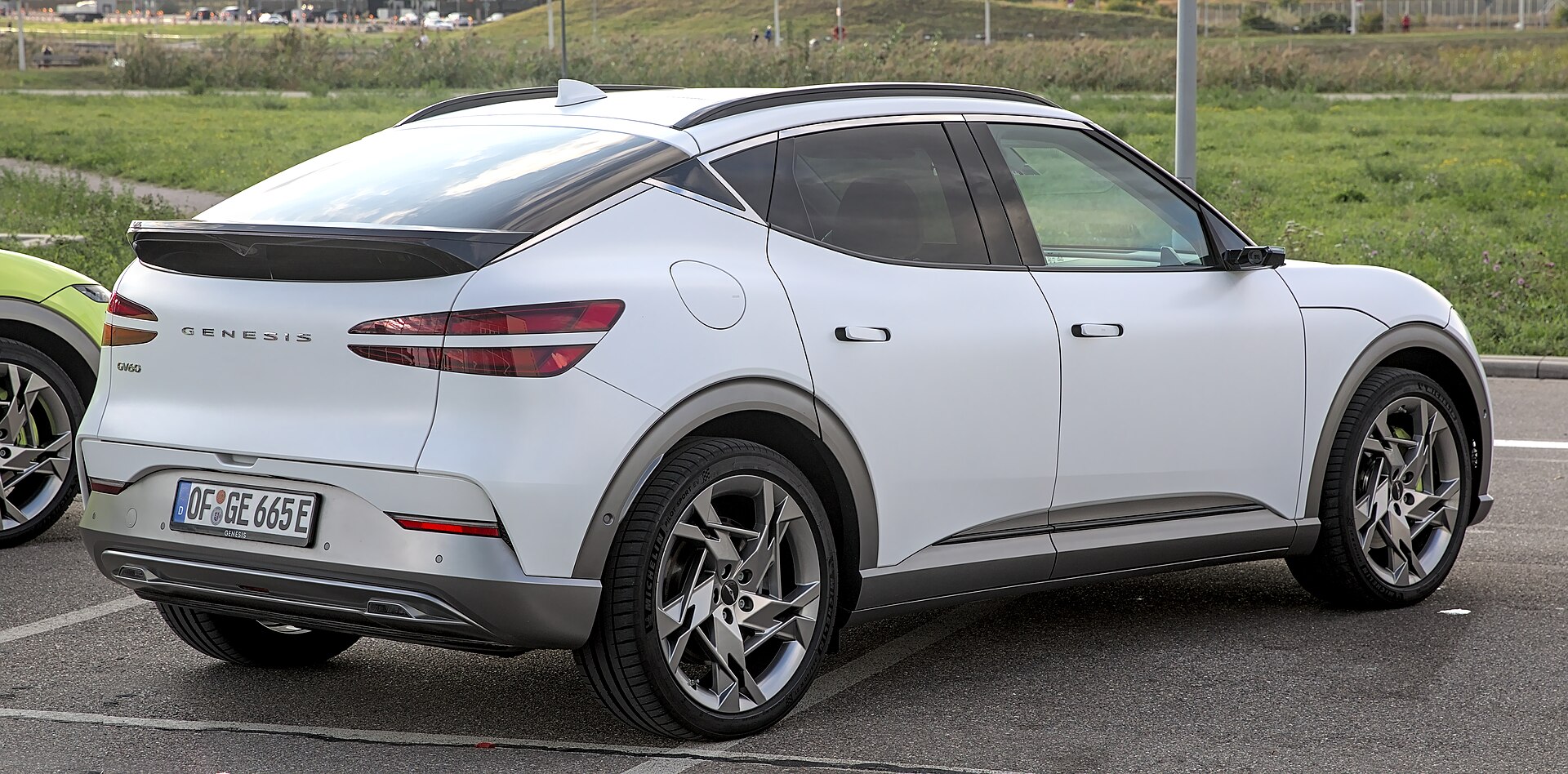 Genesis GV60, rear three-quarter view