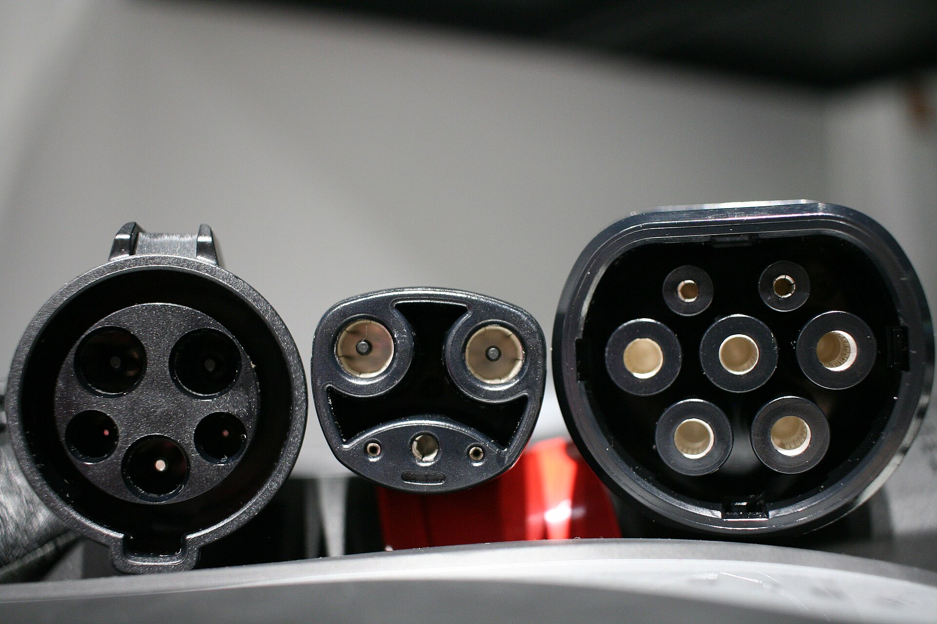 Close-up of electric car charging inlets and a Type 2 connector