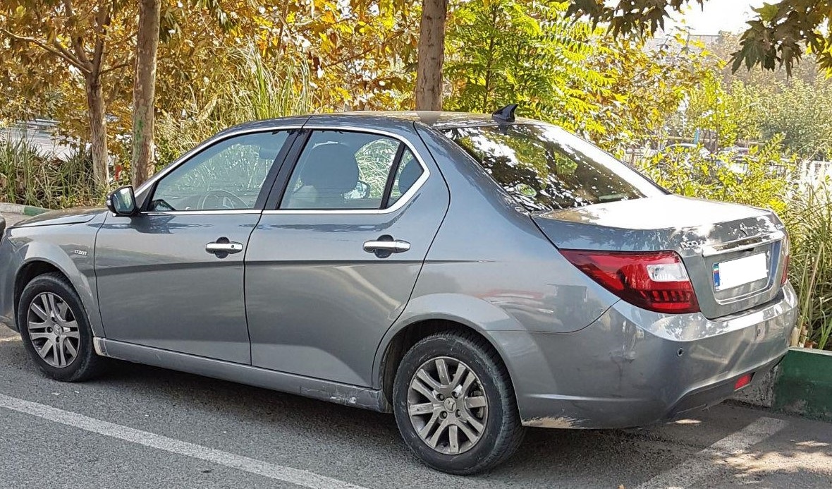 White IKCO Dena saloon, rear and side view