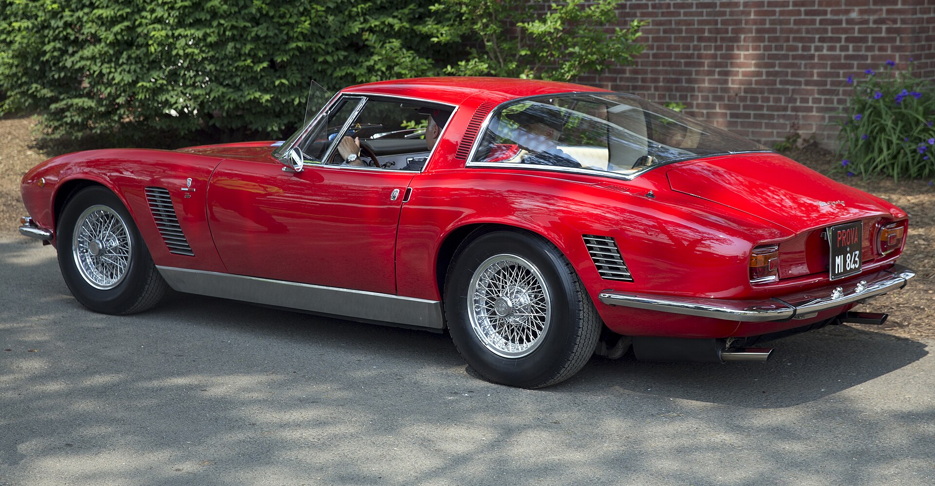 Red Iso Grifo coupé, rear three-quarter view