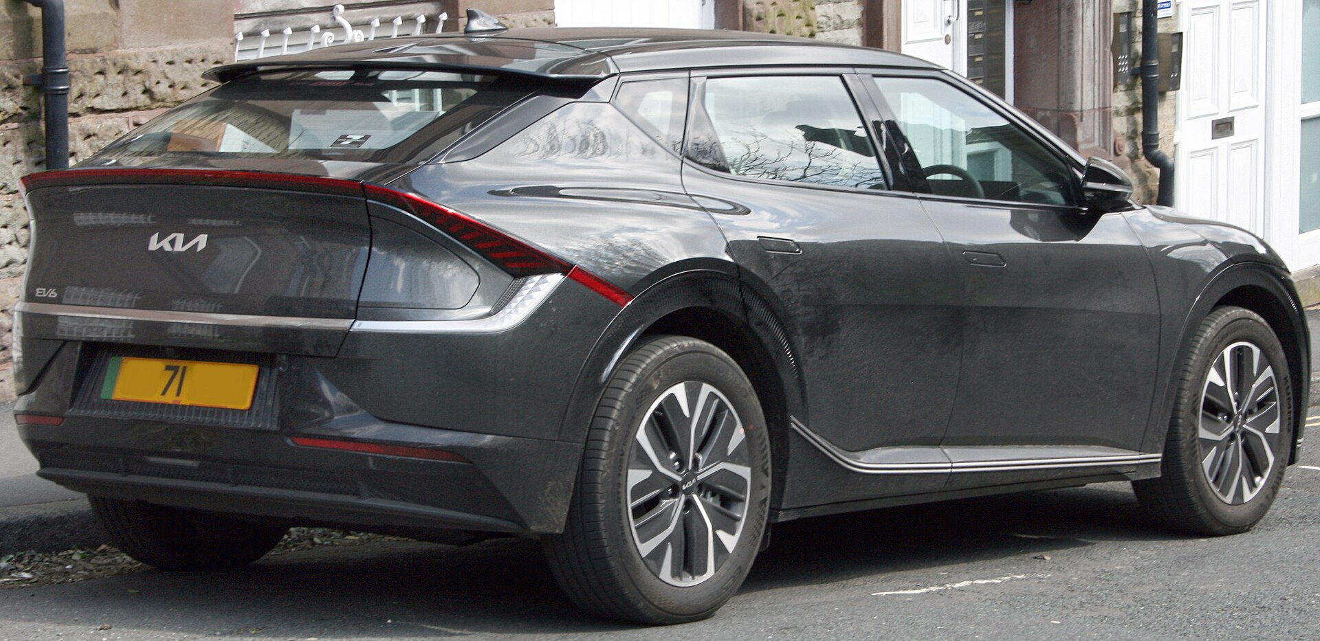Kia EV6 with full-width rear light bar, rear three-quarter view