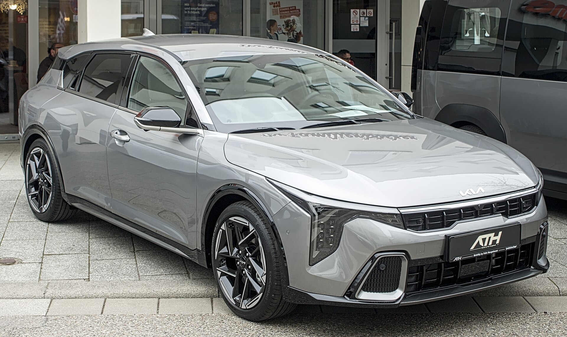 Kia K4 CL4 hatchback at a motor show, exterior view