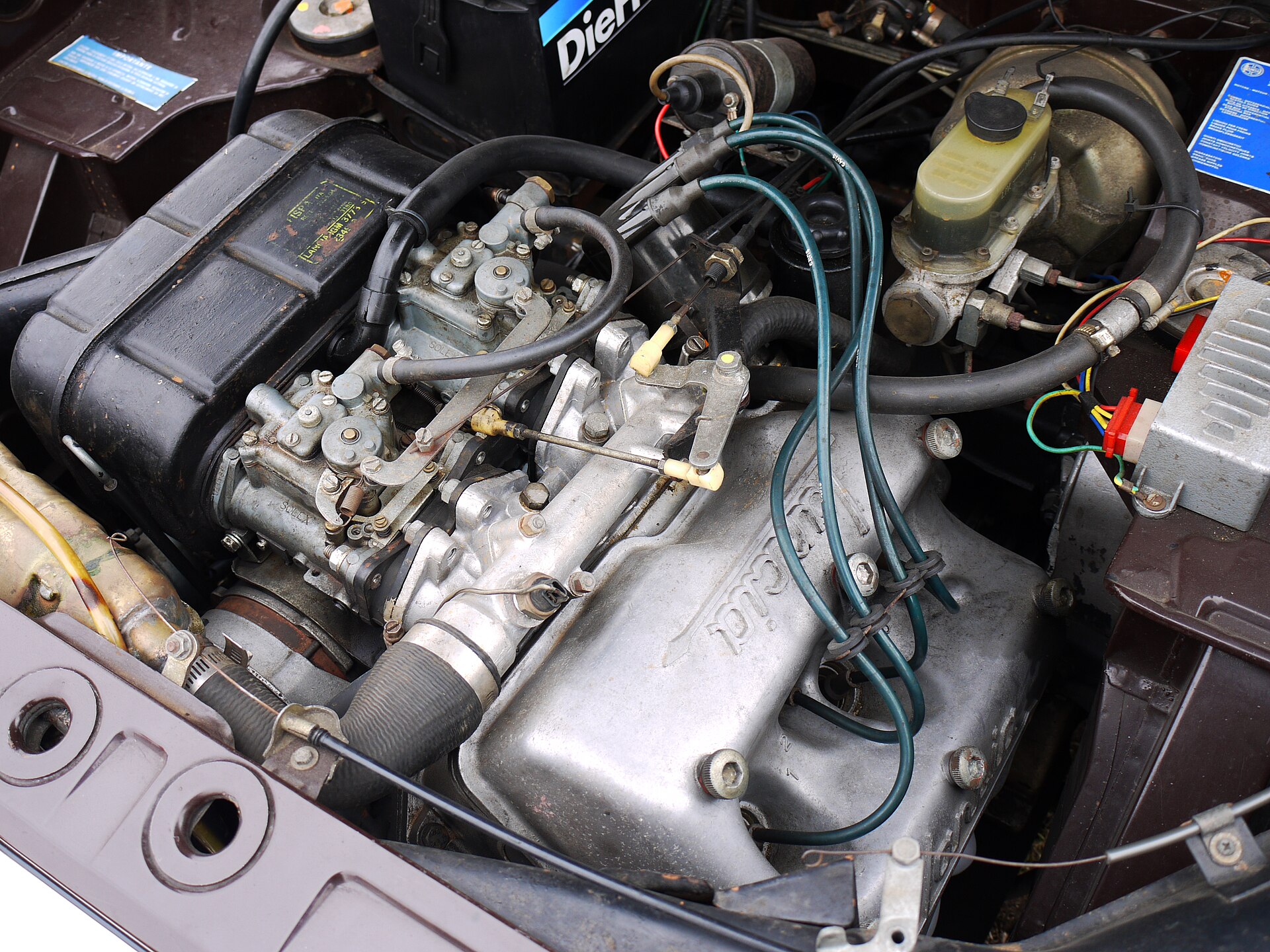 Engine bay of a 1972 Lancia Fulvia with the V4