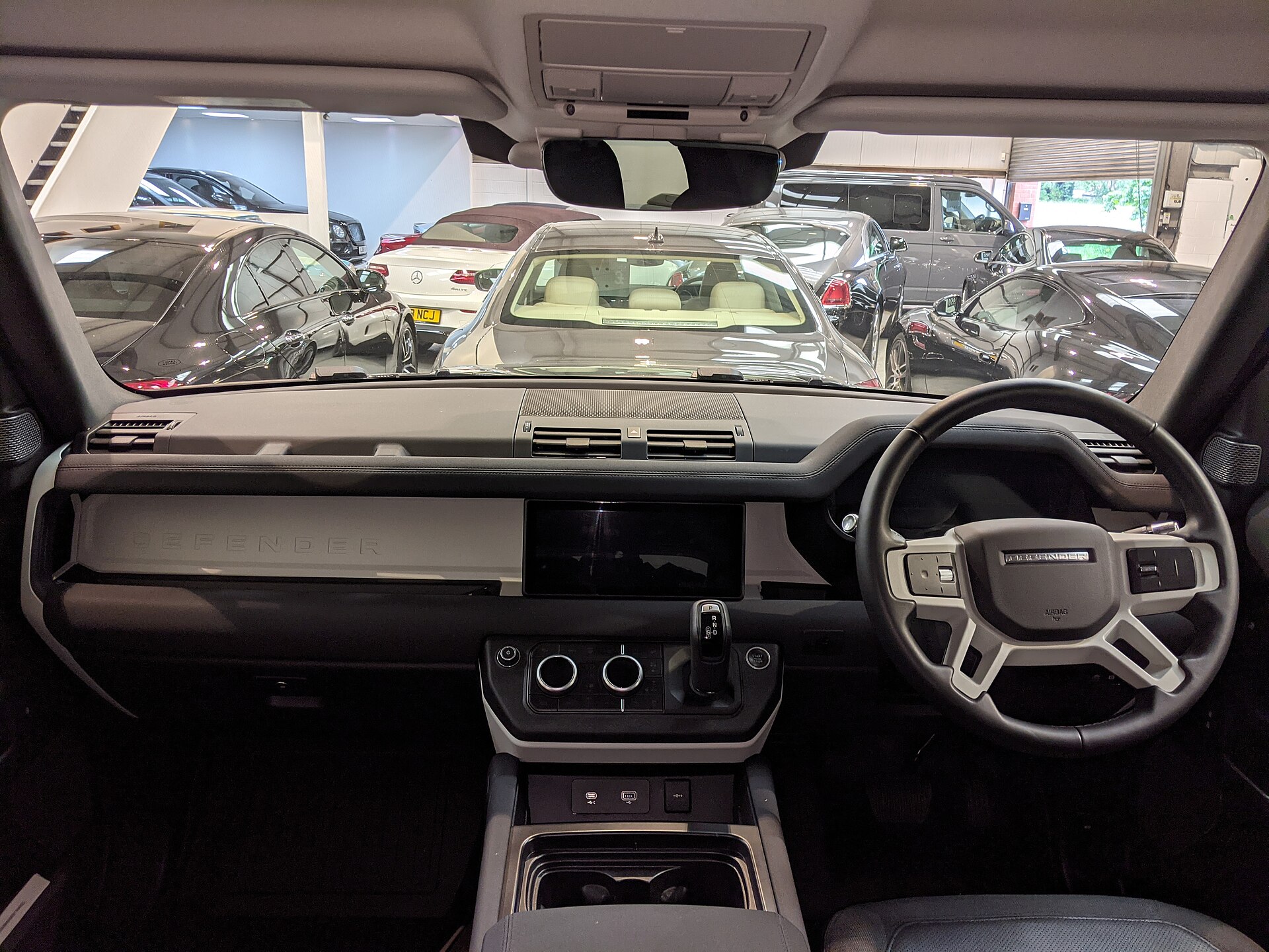 Interior of a 2020 Land Rover Defender S, dashboard and front seats