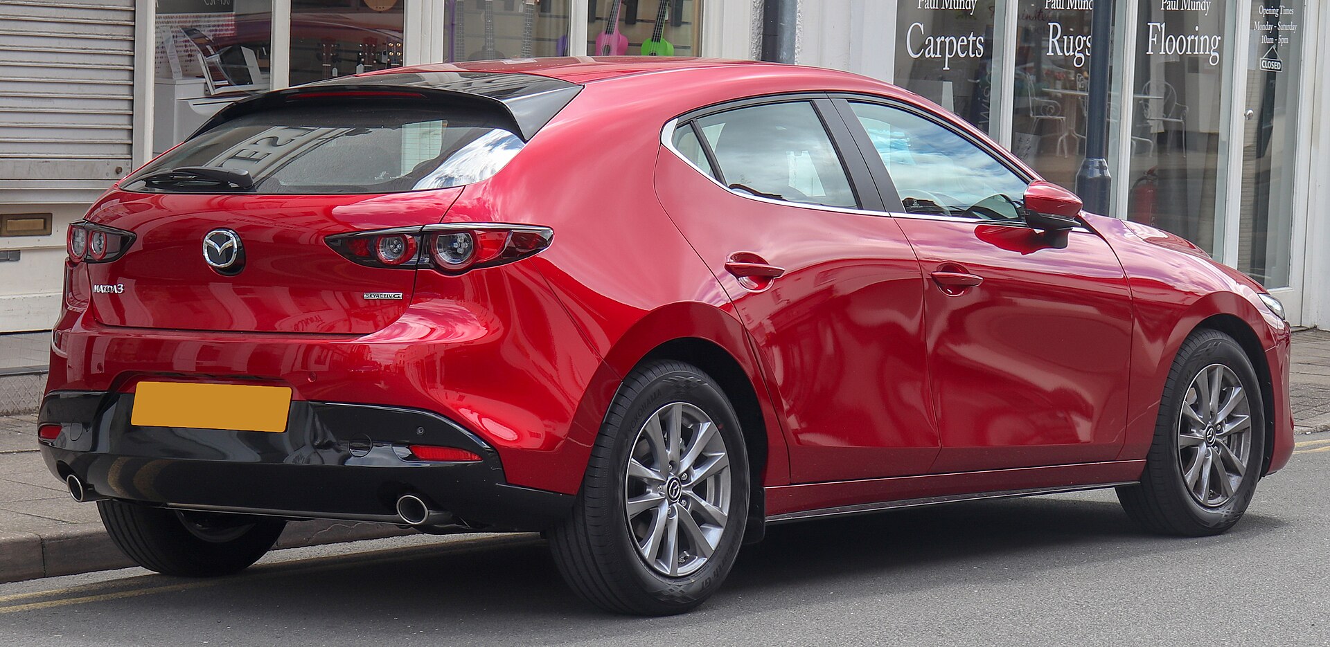 Mazda3 fourth generation, rear three-quarter view with thick C-pillar