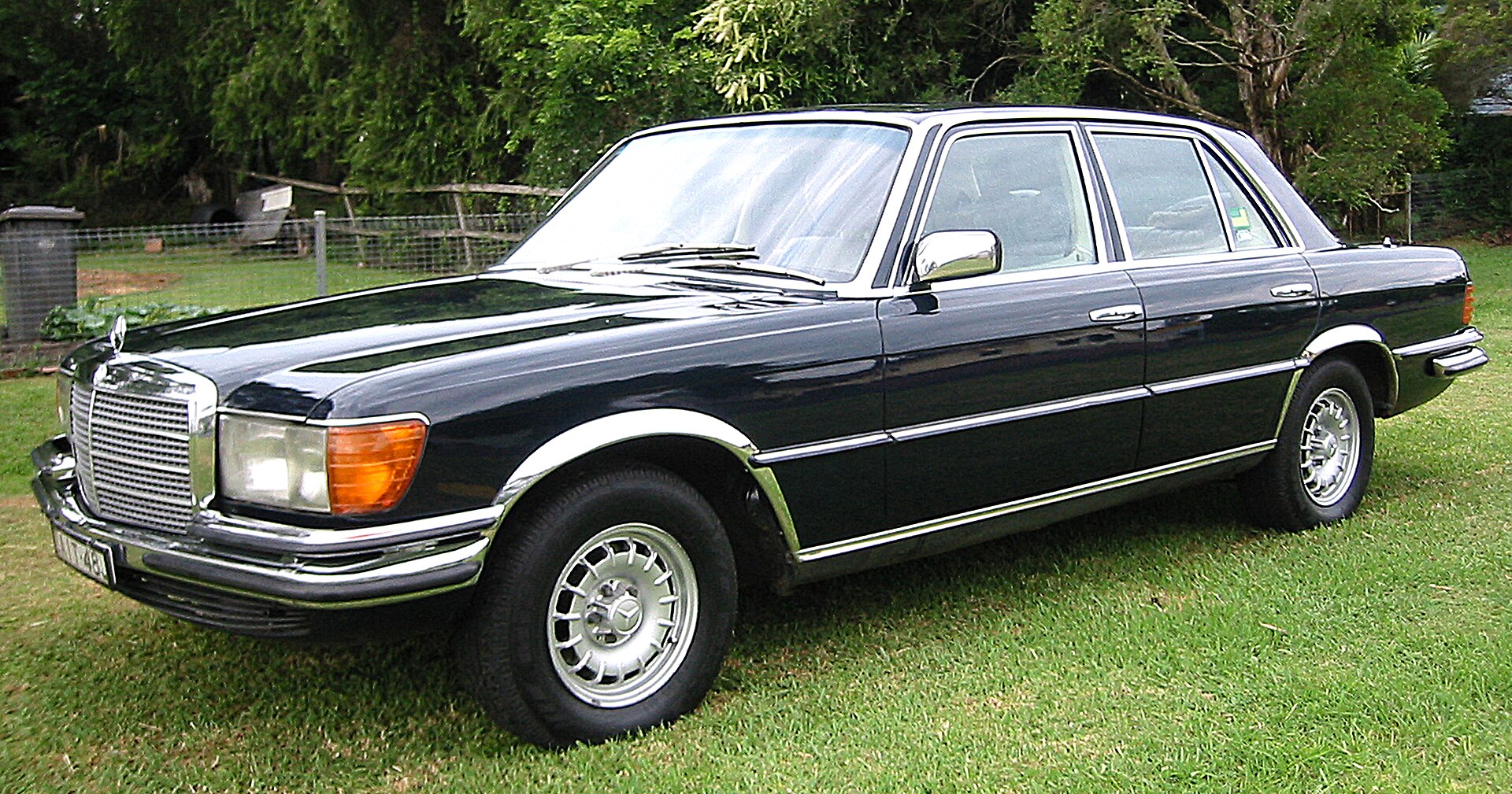 Mercedes-Benz W116 S-Class sedan in dark blue, side view