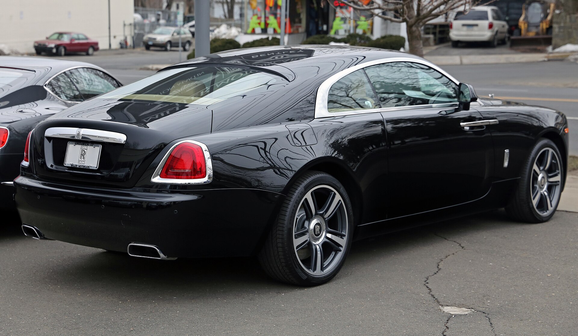 Rear view of a black 2014 Rolls-Royce Wraith
