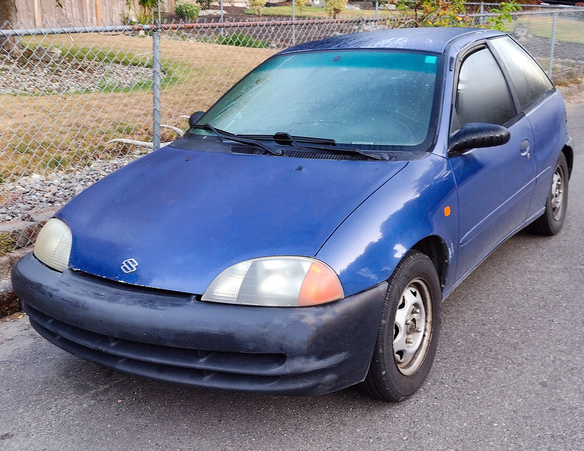 Blue Cultus-based Suzuki Swift hatchback of 1998