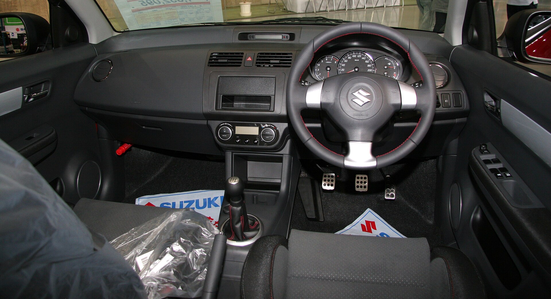 Dashboard and sports seats of a Suzuki Swift Sport