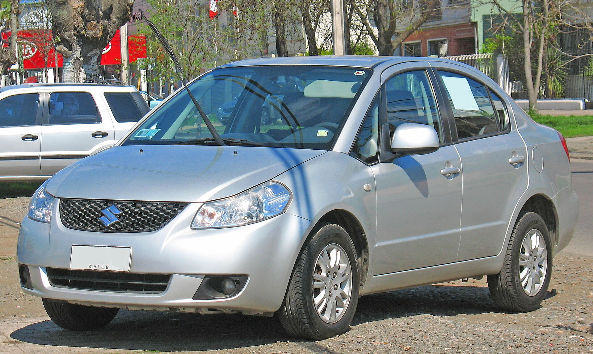 Suzuki SX4 four-door saloon, front three-quarter view