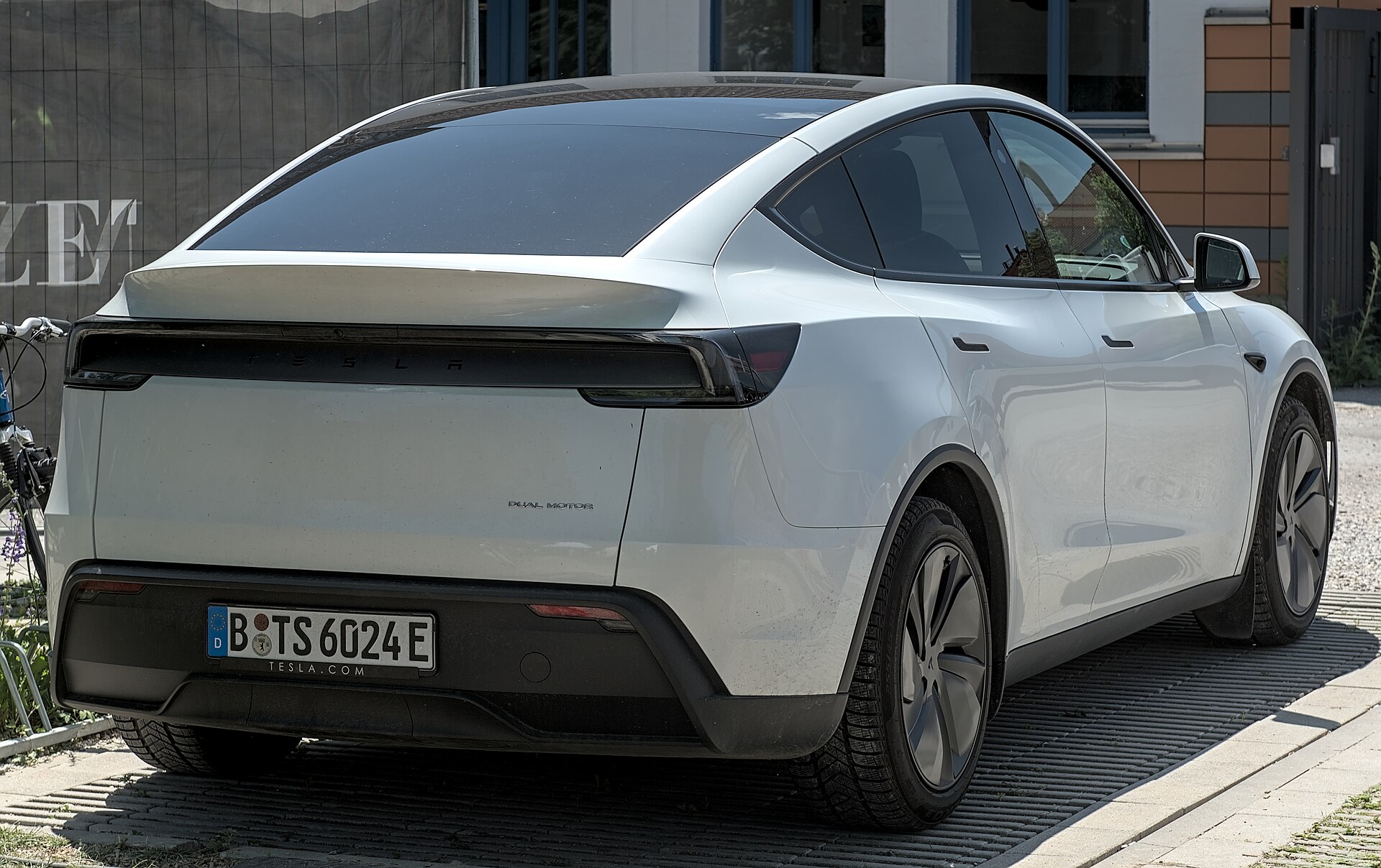 Rear three-quarter view of the 2025 Tesla Model Y