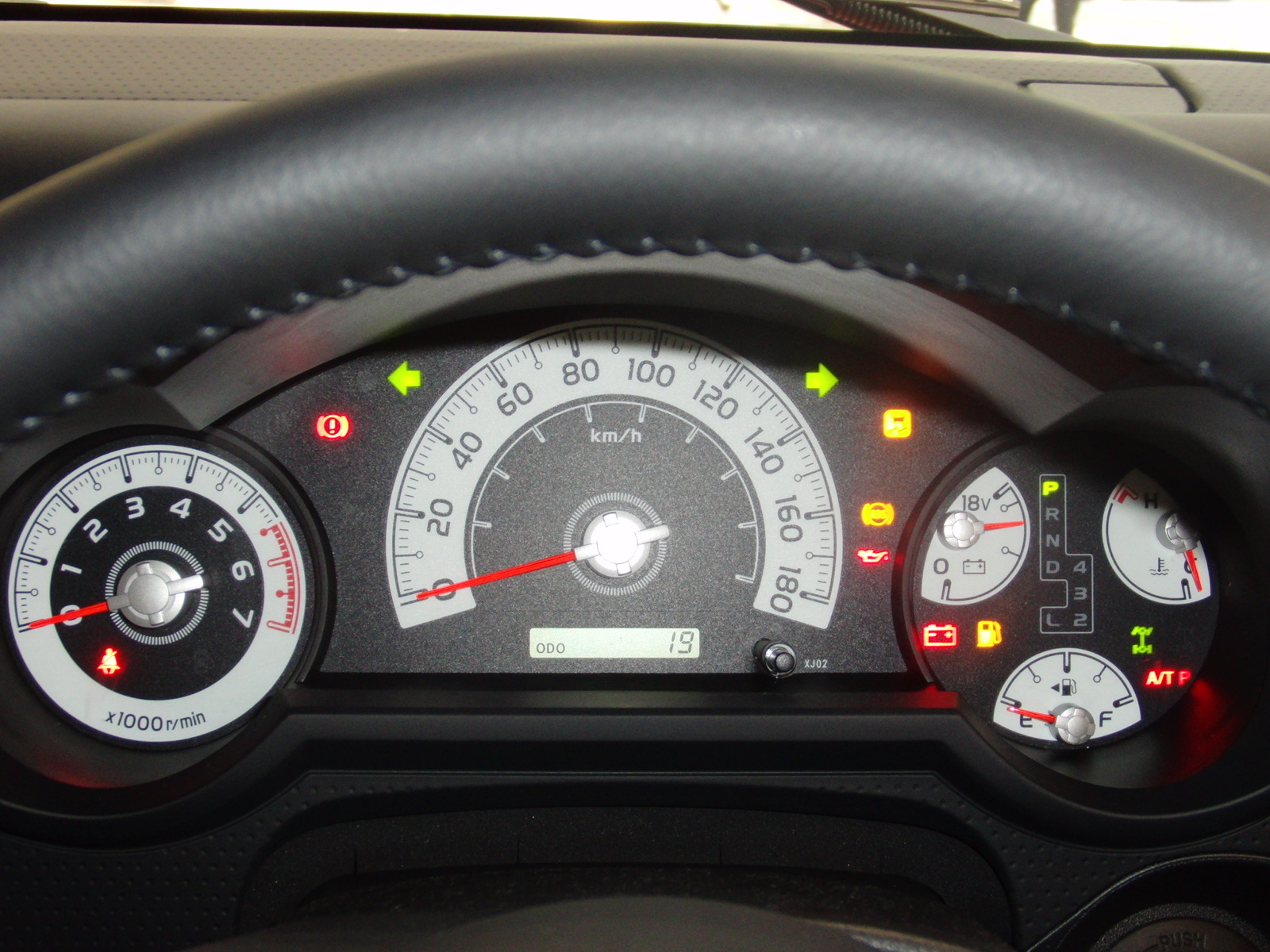 Interior of a Toyota FJ Cruiser with dashboard and steering wheel