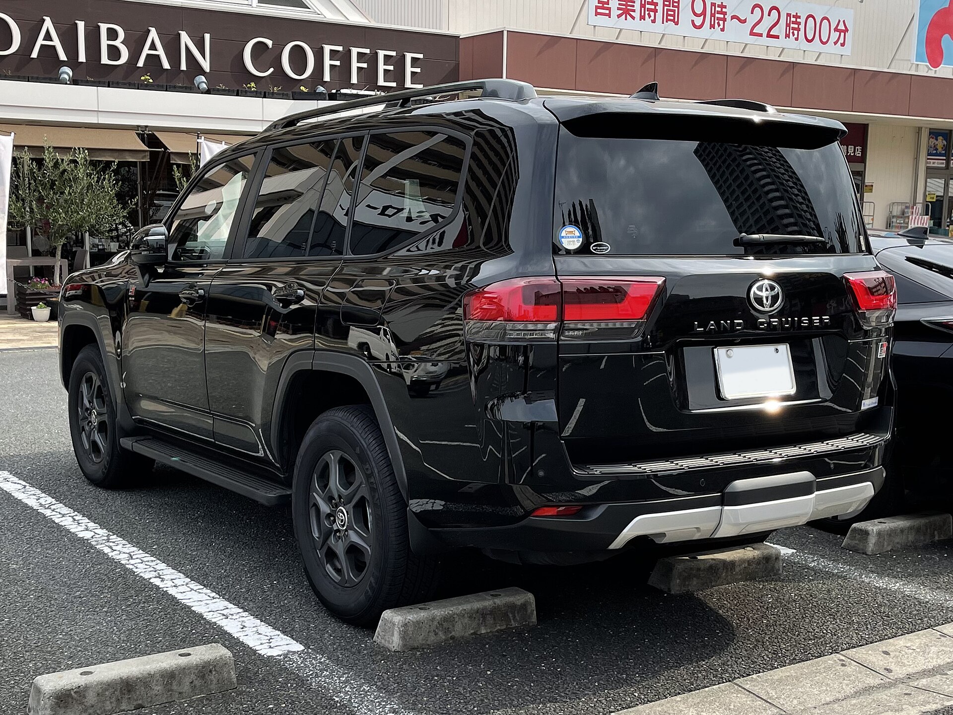 Toyota Land Cruiser 300 GR Sport, rear three-quarter view
