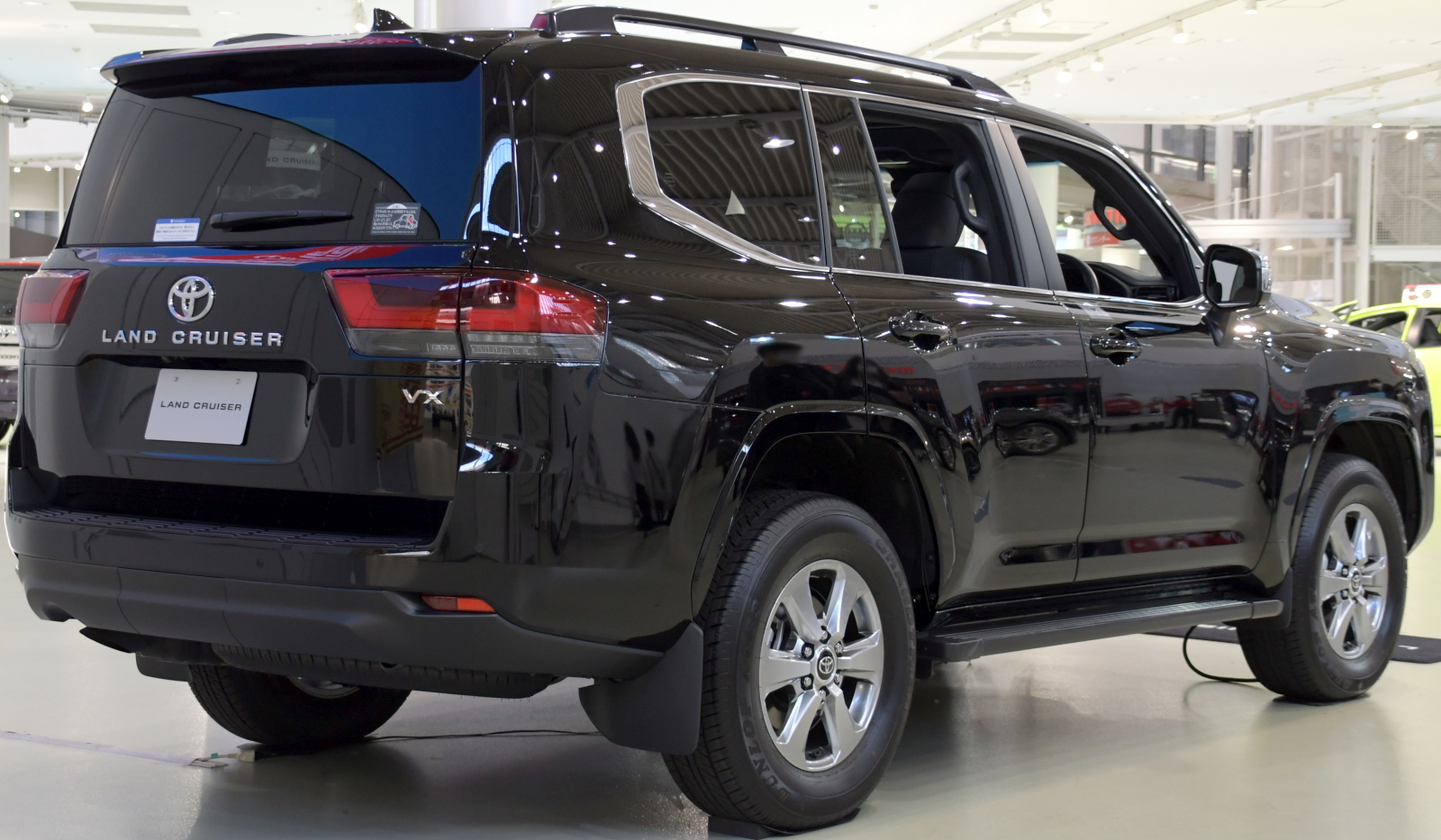 Toyota Land Cruiser 300 VX, rear three-quarter view