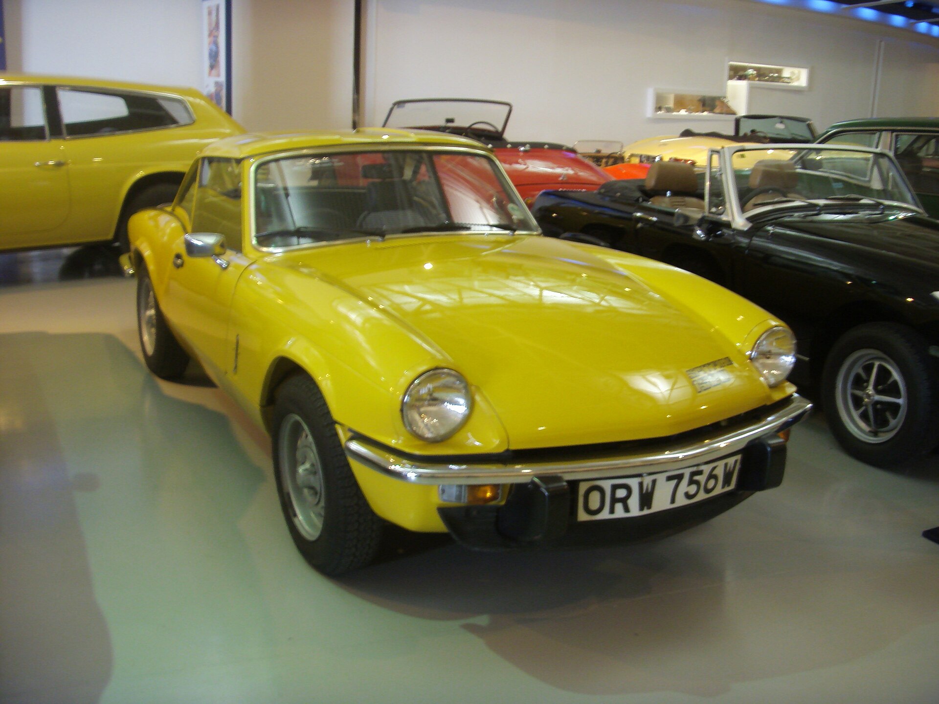 Yellow 1980 Triumph Spitfire 1500 in a museum
