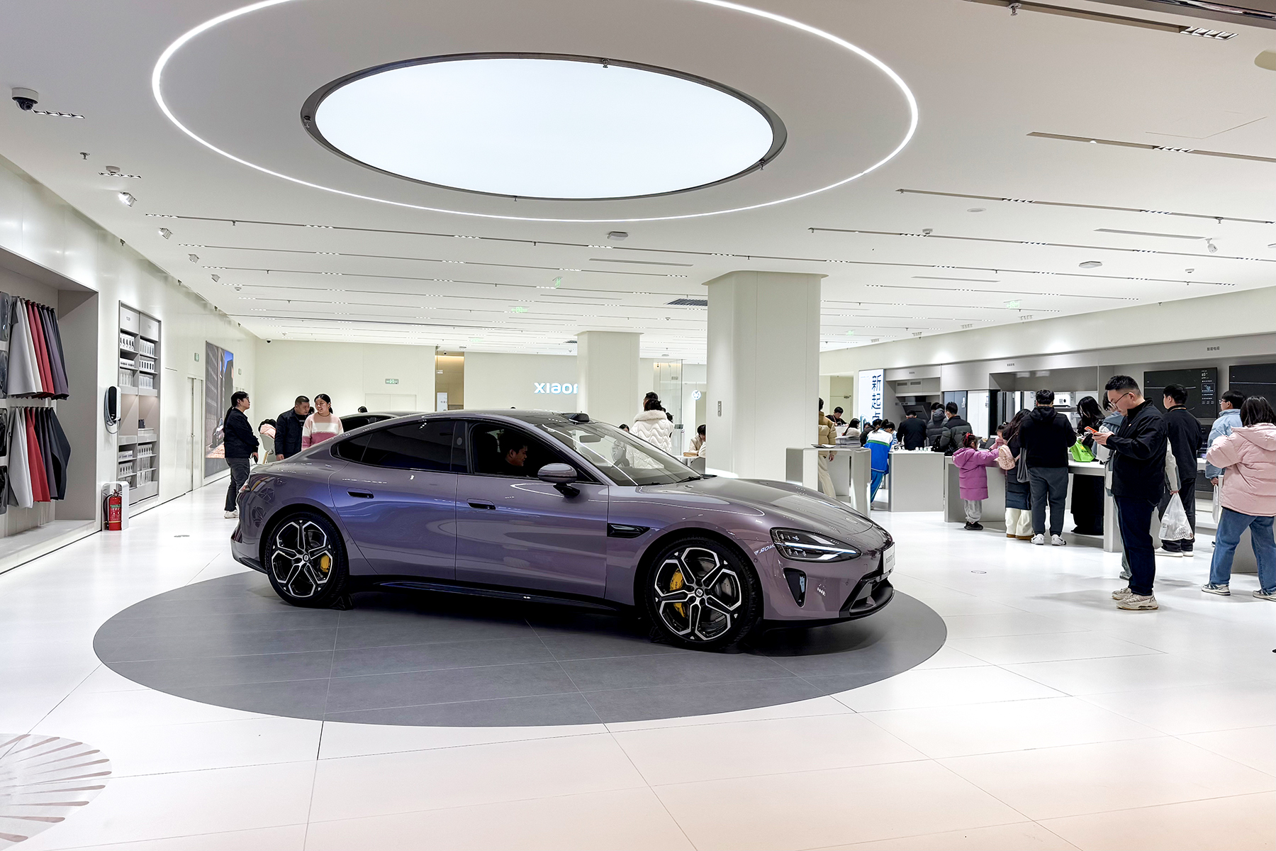 Xiaomi SU7 displayed inside a shop
